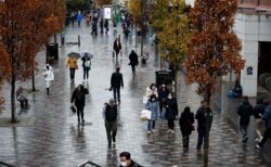 Shoppers walk through the Liverpool City Centre, in Liverpool, Britain, Dec. 13, 2021.