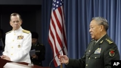 Chairman of the Joint Chiefs of Staff Adm. Mike Mullen, left, and China's Gen. Chen Bingde speak during a media availability at the Pentagon, Washington, May 18, 2011