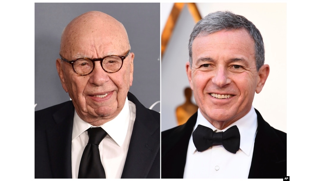FILE - This combination photo shows Fox News chairman and CEO Rupert Murdoch at the WSJ Magazine 2017 Innovator Awards in New York, Nov. 1, 2017, left, and Disney CEO Bob Iger at the Oscars in Los Angeles, March 4, 2018.