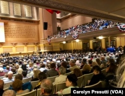 At the interfaith service, 2,300 attendees inside heard a parade of religious leaders at the podium, many speaking of love and unity.