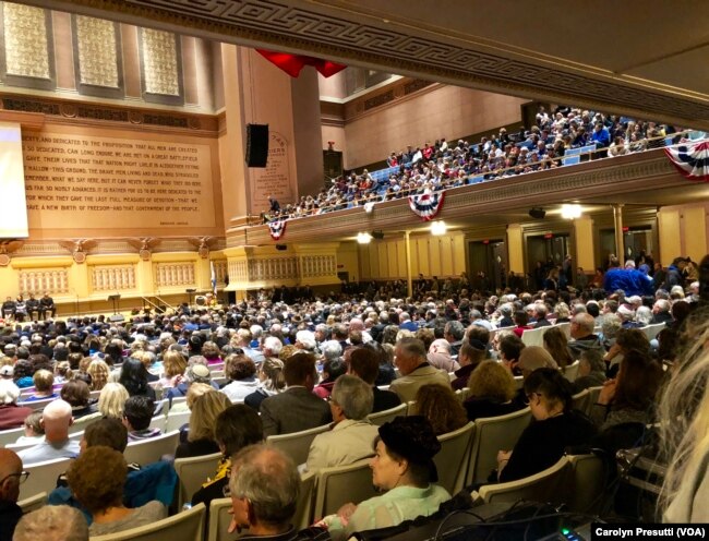 At the interfaith service, 2,300 attendees inside heard a parade of religious leaders at the podium, many speaking of love and unity.