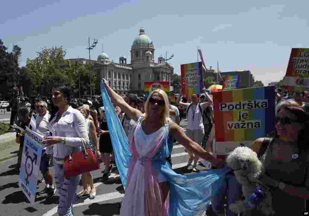 People dance during the gay pride parade in Belgrade, Serbia, June 24, 2017.