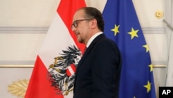 FILE _Alexander Schallenberg at news conference after being sworn in as Austrian Chancellor at the Federal Chancellery in Vienna, Oct. 11, 2021.