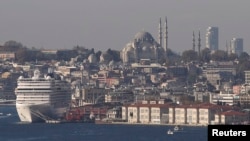 FILE - Minarets of the Ottoman-era Suleymaniye mosque punctuate Istanbul’s skyline. Turkey is building mosques abroad as President Tayyip Erdogan seeks to expand influence in the Muslim world.