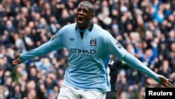 Manchester City's Yaya Toure celebrates his goal against Chelsea during their English Premier League soccer match at the Etihad Stadium in Manchester, northern England, February 24, 2013. REUTERS/Darren Staples (BRITAIN - Tags: SPORT SOCCER) FOR EDITORIA