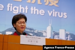 FILE - Hong Kong's Chief Executive Carrie Lam holds a press conference as her government announces strict new anti-coronavirus controls in Hong Kong, Jan. 5, 2022.
