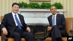 President Barack Obama meets with Chinese Vice President Xi Jinping, Feb., 14, 2012, in the Oval Office of the White House in Washington. 