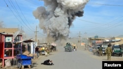 Smoke rises in the sky after a suicide car bomb attack in Kunduz province, February 10, 2015.
