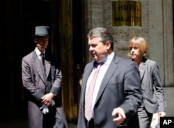 FILE - Sigmar Gabriel, Germany's finance minister and vice chancellor, in foreground, has dismissed a Greek demand for an international bailout.