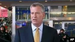 FILE - In this photo provided by WNYW Fox 5 NY, New York Mayor Bill de Blasio speaks during a news conference in New York's Times Square, Nov. 18, 2015.