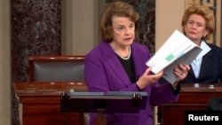 Senate Intelligence Committee Chairwoman Dianne Feinstein (D-CA) (L) discusses a newly released Intelligence Committee report on the CIA's anti-terrorism tactics, in a speech on the floor of the U.S. Senate, in this still image taken from video, on Capito