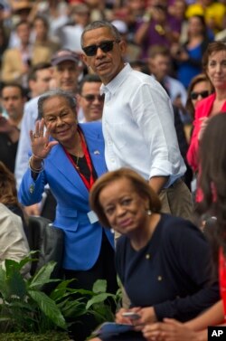 President Barack Obama and Rachel Robinson, left, widow of baseball hall-of-famer Jackie Robinson, attend the exhibition game between the MLB Tampa Bay Rays and the Cuban National team, in Havana, Cuba, March 22, 2016.