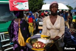 FILE - After winning second term in runoff, President Ibrahim Boubacar Keïta needs to build public confidence, observers say.