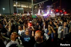 Demonstrators gather near the Staples Center during a march through the streets of downtown Los Angeles in protest following the election of Republican Donald Trump as president of the United States, Nov. 10, 2016.