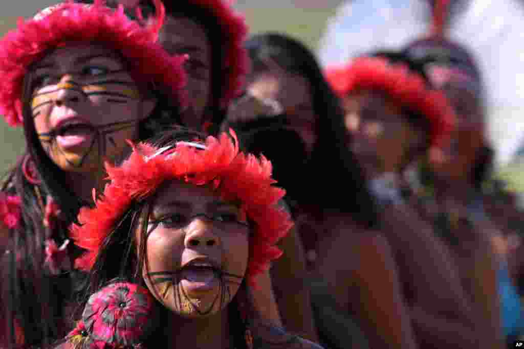 Brazilian Pataxo women take part in a ritual dance during a protest against a proposed constitutional amendment that would put the demarcation of indigenous lands into the hands of the Congress, in front of the Brazil&rsquo;s National Congress, in Brasilia, Brazil.