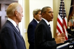 President Barack Obama, accompanied by Vice President Joe Biden and Secretary of State John Kerry, announces he's rejecting the Keystone XL pipeline because he does not believe it serves the national interest, Nov. 6, 2015.