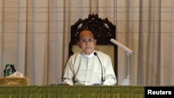 Myanmar's President Thein Sein talks during a meeting with representatives from civil societies at the Yangon Region Parliament Building in Rangoon, January 20, 2013.