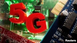 FILE PHOTO: 3d printed objects representing 5G are put on a motherboard in this picture illustration taken April 24, 2020. (REUTERS/Dado Ruvic /Illustration)