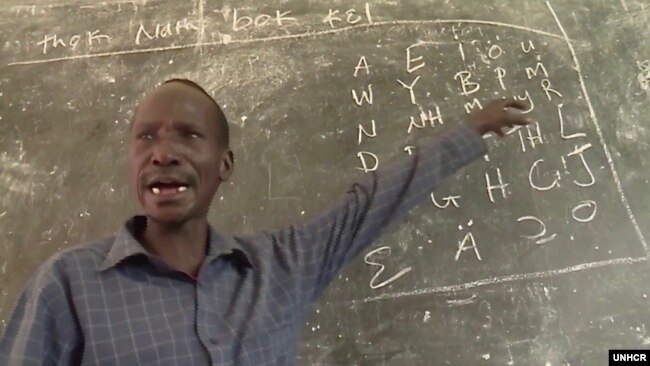 Koat Reath is shown in the classroom where he teaches young refugees from South Sudan at the Jewi refugee camp in Gambella, Ethiopia. (Photo: UNHCR)