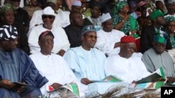 FILE - Muhammadu Buhari, former military ruler and presidential aspirant (C), and other party leaders attends the All Progressive Congress party convention in Lagos, Nigeria.