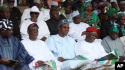 FILE - Muhammadu Buhari, former military ruler and presidential aspirant, center, and other party leaders attends the All Progressive Congress party (APC) convention in Lagos, Nigeria, April. 18, 2013.