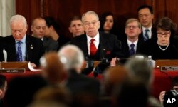 FILE - Senate Judiciary Committee Chairman Sen. Charles Grassley, center, flanked by the committee's ranking member, Sen. Dianne Feinstein and Sen. Orrin Hatch, questions Attorney General-designate, Sen. Jeff Sessions.