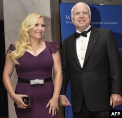 FILE - U.S. Sen. John McCain and his daughter, Meghan McCain, arrive at the White House Correspondents' Association annual dinner in Washington, May 3, 2014.