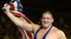 Rulon Gardner waves the American flag following his gold medal win against three-time Olympic gold medalist Alexandre Kareline, of Russia, in the Greco-Roman 130 kg final wrestling match at the XXVII Summer Games in Sydney, 27 Sep 2000 (file photo)