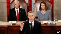 NATO Secretary General Jens Stoltenberg, with U.S. Vice President Mike Pence and U.S. House Speaker Nancy Pelosi in the background, addresses a joint session of Congress, on Capitol Hill in Washington, April 3, 2019.