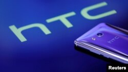 FILE - Google is buying a piece of HTC, which made Google's Pixel phone.