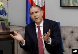 U.S. Assistant Secretary of State for Consular Affairs Carl C. Risch gestures during a news conference in Phnom Penh, Cambodia, Feb. 9, 2018. Rich was in Cambodia to talk with senior government officials about resuming the repatriation of convicted Cambod