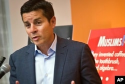 FILE - Muslim comedian Dean Obeidallah speaks at a news conference in New York, June 25, 2015.