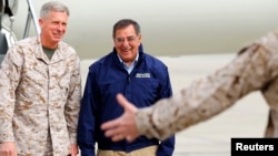 FILE - Lt. General Thomas Waldhauser, left, of 1st Marine Expeditionary Force greets then-U.S. Secretary of Defense Leon Panetta upon his arrival at Camp Pendleton, California, March 30, 2012. Waldhauser is President Barack Obama's nominee to lead the U.S. mi