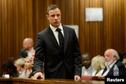 South African Olympic and Paralympic track star Oscar Pistorius attends his sentencing at the North Gauteng High Court in Pretoria, October 21, 2014.