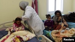 Children, who Libyan forces said left the last cluster of buildings controlled by Islamic State in the group's former stronghold of Sirte, receive medical treatment in a hospital in Misrata, Libya, Dec. 4, 2016. UNICEF says more than 500,000 children in Libya need help.