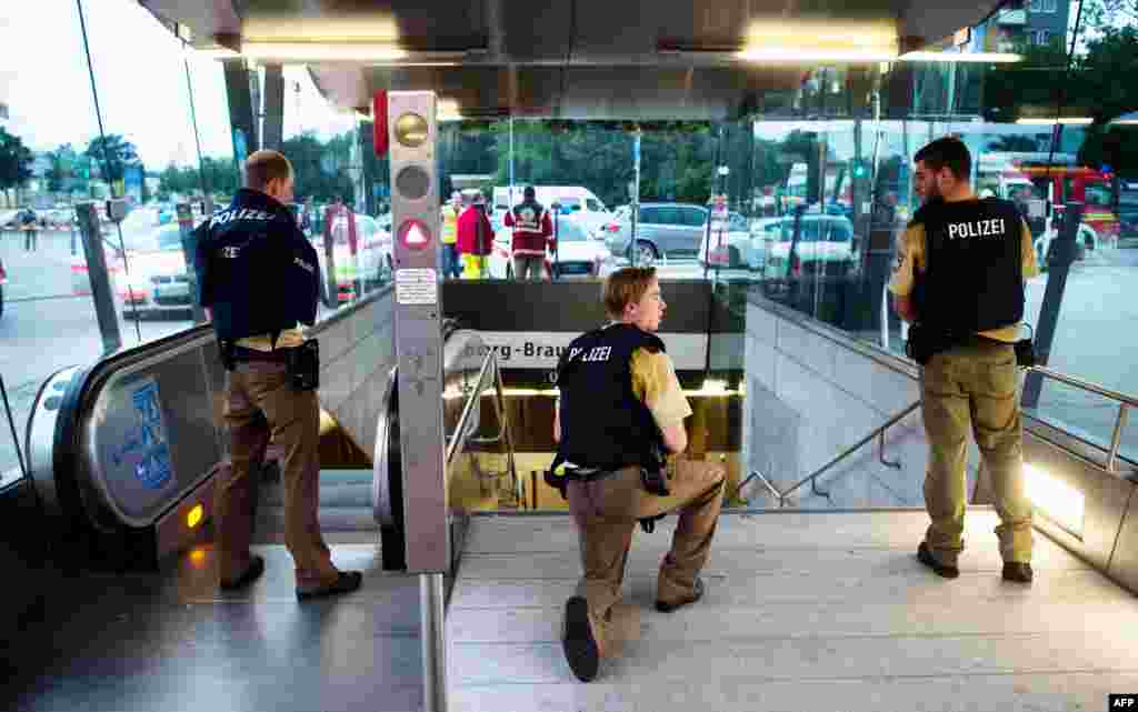 Police secures the entrance to a subway station near a shopping mall where a shooting took place on July 22, 2016 in Munich.