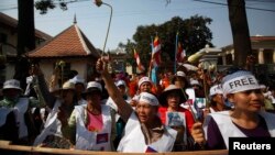 Protesters gather in front of the Appeals Court during a protest near the Royal Palace in central Phnom Penh, Feb. 10, 2014.