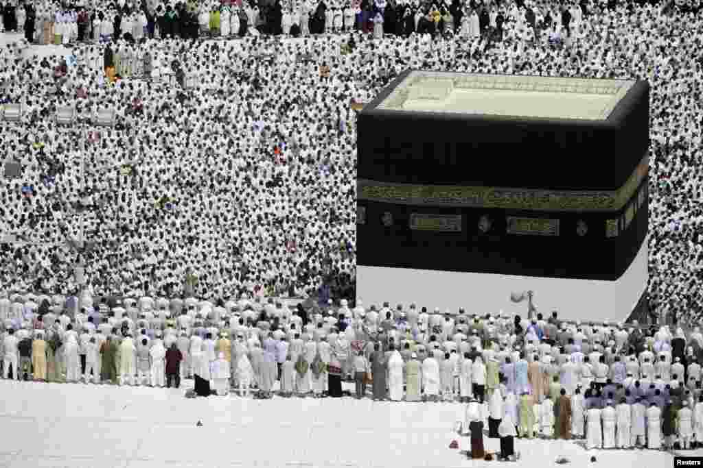 Muslim pilgrims attend Friday prayers at the Grand Mosque during the annual haj pilgrimage in the holy city of Mecca October 19