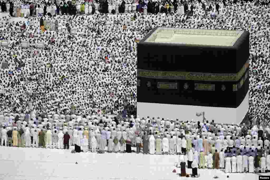 Muslim pilgrims attend Friday prayers at the Grand Mosque during the annual haj pilgrimage in the holy city of Mecca October 19 