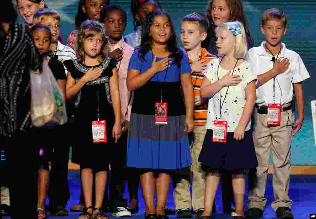 A group of third grade students rehearse saying the Pledge of Allegiance ahead of the first day of the convention in Time Warner Cable Arena, September 4, 2012. 