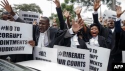 FILE: Lawyers of the Law Society of Zimbabwe bar association take part in a "March for Justice" toward the Constitutional Court in Harare on January 29, 2019, to call for restoration of the rule of law, respect of human rights as well as the country's Constitution. (Photo by Jeke