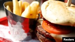 This double hamburger with a side of French fries would definitely make a meat-and-potato person smile.(REUTERS/Dominick Reuter)