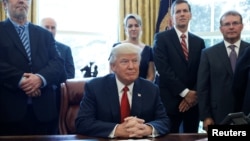 U.S. President Donald Trump speaks before signing a directive ordering an investigation into the impact of foreign steel on the American economy in the Oval Office of the White House in Washington, April 20, 2017. 
