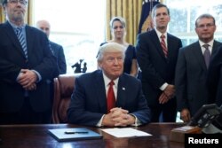 U.S. President Donald Trump speaks before signing a directive ordering an investigation into the impact of foreign steel on the American economy in the Oval Office of the White House in Washington, April 20, 2017.