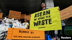 Greenpeace activists protest in front of the Foreign Ministry ahead of the 34th ASEAN summit in Bangkok, Thailand June 20, 2019. 