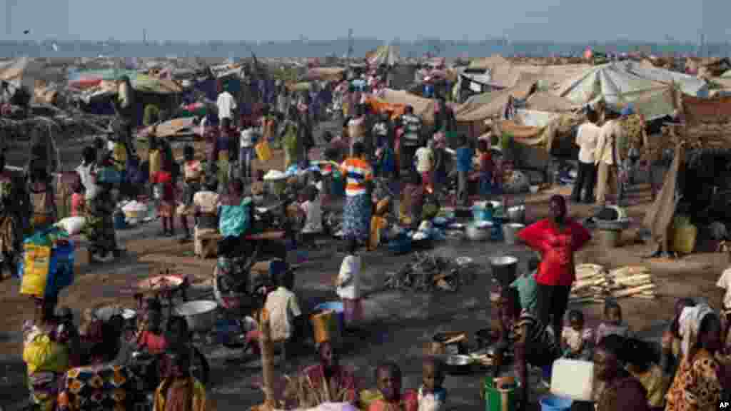 People displaced by violence in a sprawling camp at Mpoko Airport, in Bangui, Central African Republic, Thursday, Jan. 2, 2014.