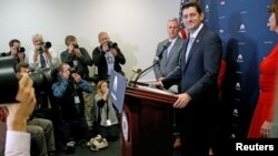 FILE - U.S. House Speaker Paul Ryan (R, at lectern) arrives for a news conference after his caucus meeting with fellow House Republicans at the U.S. Capitol in Washington, Nov. 15, 2016.