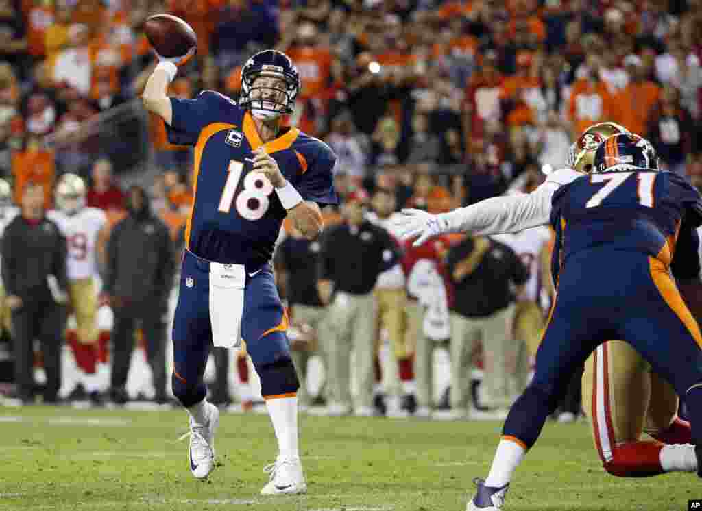 Denver Broncos quarterback Peyton Manning throws his 509th career touchdown pass during the first half of an NFL football game against the San Francisco 49ers in Denver, Oct. 19, 2014.
