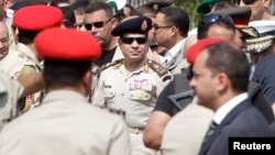 Egyptian Army Chief, General Abdel Fattah el-Sissi (C), is seen in Cairo's Nasr City district in this September 20, 2013, file photo.
