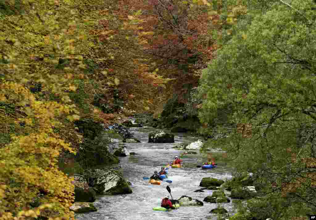 People paddle along the Loisach river in Garmisch-Partenkirchen, Germany.